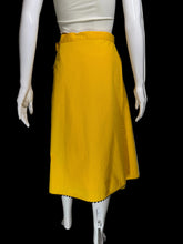 Load image into Gallery viewer, Yellow skirt with a white floral applique against a white background.