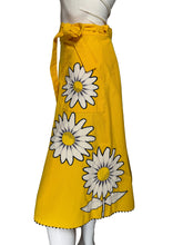 Load image into Gallery viewer, Yellow skirt with a white floral applique against a white background.