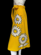Load image into Gallery viewer, Yellow skirt with a white floral applique against a white background.