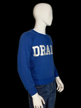 Load image into Gallery viewer, Mannequin wearing a blue sweatshirt with 'DRAKE' text on a white background