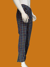 Load image into Gallery viewer, Plaid flared pants against a white background.