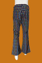Load image into Gallery viewer, Plaid flared pants against a white background.
