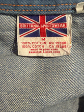 Load image into Gallery viewer, Label with British flag and Brittania Sportswear logo on a denim fabric background
