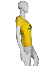 Load image into Gallery viewer, Mannequin wearing a yellow t-shirt with a colorful design on a plain background