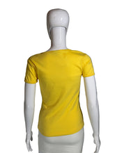 Load image into Gallery viewer, Mannequin wearing a yellow top against a gray background