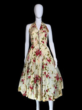 Load image into Gallery viewer, Floral dress on a mannequin against a plain background