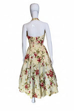 Load image into Gallery viewer, Floral dress on a mannequin against a plain wall.