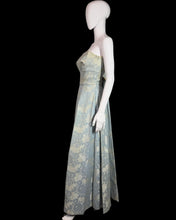 Load image into Gallery viewer, Mannequin wearing a strapless floral gown on a white background