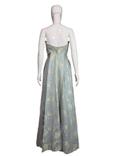 Load image into Gallery viewer, Mannequin wearing a floral dress against a plain wall.