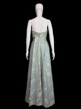Load image into Gallery viewer, Mannequin wearing a floral dress against a plain wall.