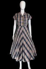 Load image into Gallery viewer, Plaid dress on a mannequin against a plain wall