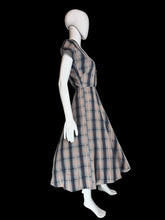 Load image into Gallery viewer, Plaid dress on a mannequin against a plain wall.