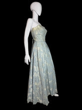 Load image into Gallery viewer, Mannequin wearing a floral dress against a white wall.