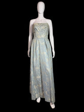 Load image into Gallery viewer, Light blue floral dress on a mannequin against a plain wall.