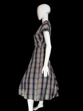 Load image into Gallery viewer, Mannequin wearing a plaid dress against a plain wall.
