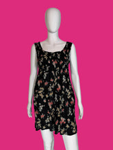 Load image into Gallery viewer, Floral dress on a mannequin against a plain background