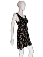 Load image into Gallery viewer, Floral dress on a mannequin against a plain background