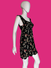 Load image into Gallery viewer, Floral dress on a mannequin against a plain background