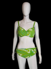 Load image into Gallery viewer, Mannequin wearing green and white patterned underwear on a gray background