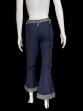 Load image into Gallery viewer, Mannequin wearing blue bell-bottom pants with a white background