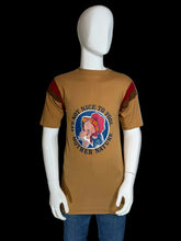 Load image into Gallery viewer, Mannequin wearing a brown t-shirt with a graphic design on a plain background