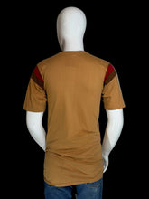 Load image into Gallery viewer, Mannequin wearing a brown t-shirt with red and black accents on a plain background