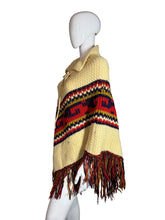 Load image into Gallery viewer, Mannequin wearing a colorful knitted poncho on a white background