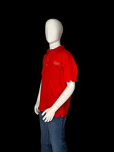 Load image into Gallery viewer, Mannequin wearing a red shirt and blue jeans on a white background