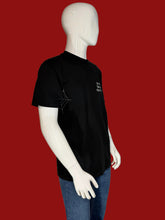 Load image into Gallery viewer, Mannequin wearing a black t-shirt with text on a plain background