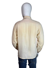 Load image into Gallery viewer, Mannequin wearing a button up shirt showcasing the tan back