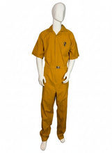 Load image into Gallery viewer, Mannequin wearing a mustard yellow jumpsuit on a white background