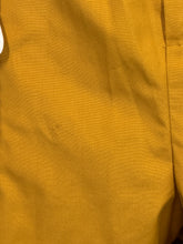 Load image into Gallery viewer, Close-up of mustard yellow fabric with a light stain