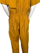 Load image into Gallery viewer, Mannequin wearing a mustard yellow jumpsuit on a white background