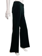 Load image into Gallery viewer, Dark green velvet pants displayed on a mannequin against a neutral background