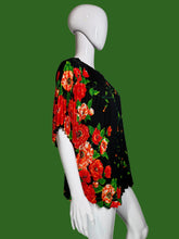 Load image into Gallery viewer, Black dress with red floral pattern on a mannequin