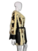 Load image into Gallery viewer, Fur coat on a mannequin against a plain background