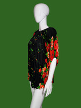 Load image into Gallery viewer, Black dress with red floral pattern on a mannequin