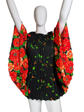 Load image into Gallery viewer, Black dress with red floral pattern on a mannequin