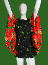 Load image into Gallery viewer, Black dress with red floral pattern on a mannequin