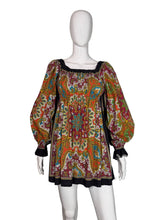 Load image into Gallery viewer, Colorful patterned garment on a mannequin against a white background