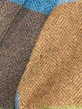Load image into Gallery viewer, Close-up of textured brown and blue fabric with small snag