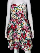 Load image into Gallery viewer, Floral tiered dress on a mannequin against a plain background