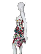 Load image into Gallery viewer, Floral dress on a white mannequin against a plain wall.