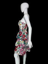 Load image into Gallery viewer, Floral dress on a white mannequin against a plain wall.