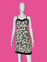 Load image into Gallery viewer, Black and white patterned dress on a mannequin against a plain background