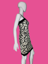 Load image into Gallery viewer, Black and white patterned dress on a mannequin against a plain background