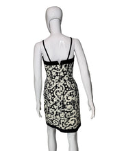 Load image into Gallery viewer, Mannequin wearing a black and white patterned dress on a plain background