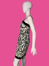 Load image into Gallery viewer, Mannequin wearing a black and white patterned dress on a white background