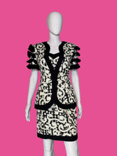 Load image into Gallery viewer, Mannequin wearing a black and white patterned dress against a plain background