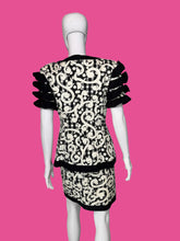 Load image into Gallery viewer, Black and white patterned dress on a mannequin against a plain background